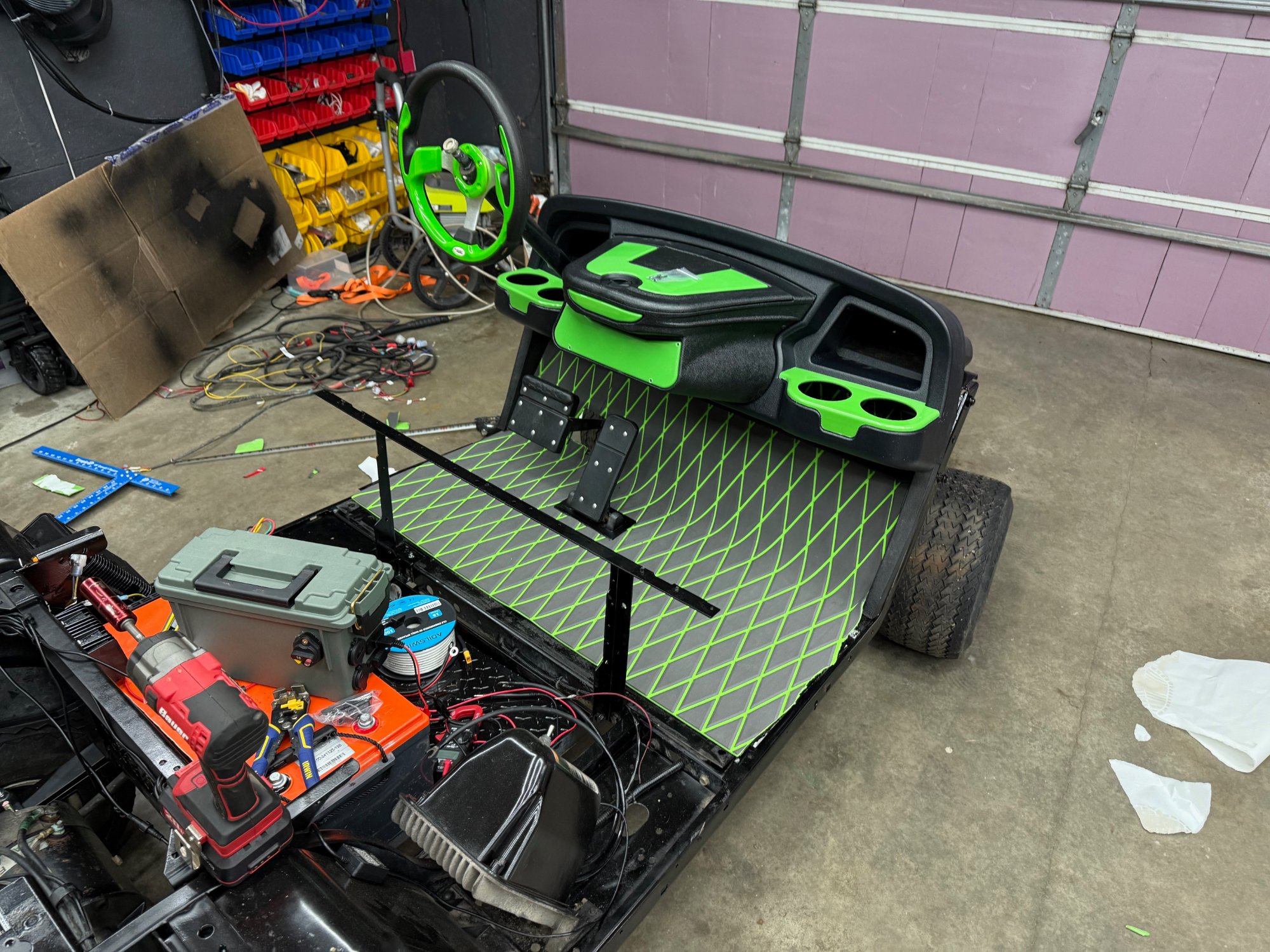 Green interior — steering wheel and diamond-stitch floor